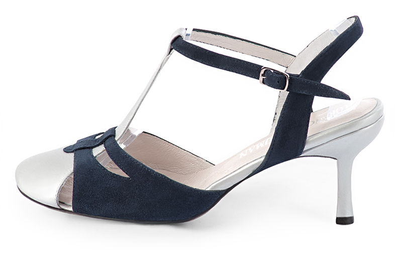 French elegance and refinement for these light silver and navy blue dress open back T-strap shoes, 
                available in many subtle leather and colour combinations. Its comfortable fit will accompany you until the end of the night.
Its charming, playful cutout gives you plenty of customization options.  
                Matching clutches for parties, ceremonies and weddings.   
                You can customize these shoes to perfectly match your tastes or needs, and have a unique model.  
                Choice of leathers, colours, knots and heels. 
                Wide range of materials and shades carefully chosen.  
                Rich collection of flat, low, mid and high heels.  
                Small and large shoe sizes - Florence KOOIJMAN